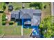 An aerial view of a home's backyard featuring a patio, trampoline, and well-maintained lawn at 2816 Fairmount Ave, Lakeland, FL 33803