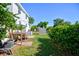 Spacious backyard featuring a wooden deck, green lawn, and mature trees at 2816 Fairmount Ave, Lakeland, FL 33803