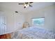 Comfortable bedroom with hardwood floors, ceiling fan, closet, and window view at 2816 Fairmount Ave, Lakeland, FL 33803