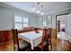 Traditional dining room with wood floors, wainscoting, and botanic wall art at 2816 Fairmount Ave, Lakeland, FL 33803