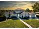 Charming two-story home with a well-maintained lawn, beautiful landscaping, and attached two-car garage at 2816 Fairmount Ave, Lakeland, FL 33803