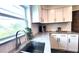 Bright kitchen with white cabinets, stainless steel appliances, granite countertops, and subway tile at 2816 Fairmount Ave, Lakeland, FL 33803