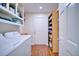 Laundry room with shelving, a washer and dryer, and hardwood floors at 2816 Fairmount Ave, Lakeland, FL 33803