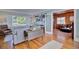 Open-concept living area showcasing hardwood floors and seamless flow to adjacent spaces at 2816 Fairmount Ave, Lakeland, FL 33803