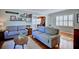 Comfortable living room featuring hardwood floors and a decorative gallery wall with various pictures at 2816 Fairmount Ave, Lakeland, FL 33803