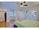 Bright main bedroom boasts hardwood floors, an ensuite bath, large windows, and multiple closets at 2816 Fairmount Ave, Lakeland, FL 33803