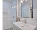 Modern bathroom features a walk-in shower with glass doors, subway tile, and updated fixtures at 2816 Fairmount Ave, Lakeland, FL 33803