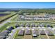Wide aerial of the neighborhood, revealing the community layout, surrounding roads, and nearby solar farm at 2929 Flying Blackbird Rd, Bartow, FL 33830