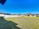 The spacious backyard has green grass and a white fence at 2929 Flying Blackbird Rd, Bartow, FL 33830