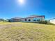 The spacious backyard has green grass at 2929 Flying Blackbird Rd, Bartow, FL 33830