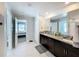 Bathroom featuring a double vanity with granite counters and tile flooring at 2929 Flying Blackbird Rd, Bartow, FL 33830