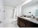 Clean bathroom with a shower-tub combo and granite countertops on the vanity at 2929 Flying Blackbird Rd, Bartow, FL 33830