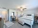A spacious bedroom features neutral walls, ceiling fan, makeup vanity and white bed frame at 2929 Flying Blackbird Rd, Bartow, FL 33830