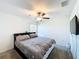 Nice bedroom featuring a mounted TV and ceiling fan at 2929 Flying Blackbird Rd, Bartow, FL 33830