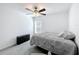 Cozy bedroom with a ceiling fan, dresser, and a comfortable bed at 2929 Flying Blackbird Rd, Bartow, FL 33830