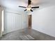 Bright bedroom featuring a ceiling fan and a closet with louvered doors at 2929 Flying Blackbird Rd, Bartow, FL 33830