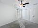 Simple bedroom with carpet flooring, a ceiling fan, and a window with natural light at 2929 Flying Blackbird Rd, Bartow, FL 33830