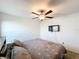Neat bedroom with a ceiling fan and mounted TV at 2929 Flying Blackbird Rd, Bartow, FL 33830