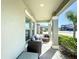 Inviting front porch with outdoor seating, perfect for relaxing and enjoying the neighborhood at 2929 Flying Blackbird Rd, Bartow, FL 33830