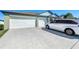 Expansive three-car garage and wide driveway, perfect for accommodating multiple vehicles at 2929 Flying Blackbird Rd, Bartow, FL 33830