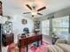 Cozy home office with a desk, stylish decor, and natural light from the window at 2929 Flying Blackbird Rd, Bartow, FL 33830