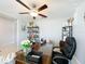 Inviting home office with a large desk, comfortable chair, and stylish bookshelves at 2929 Flying Blackbird Rd, Bartow, FL 33830