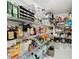Walk-in pantry with organized shelving providing ample storage space for food and kitchen essentials at 2929 Flying Blackbird Rd, Bartow, FL 33830