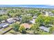 An aerial view shows a neighborhood dotted with mature trees and well-maintained homes at 2954 Jennifer Dr, Lakeland, FL 33810