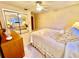 Bedroom featuring neutral tones, ceiling fan and a mirrored closet at 302 Luna Rd, Auburndale, FL 33823