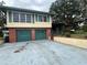Classic two-story home with brick accents and a two-car garage at 302 Luna Rd, Auburndale, FL 33823