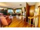 The living room is well-lit with multiple windows, hardwood floors, and a decorative fireplace at 302 Luna Rd, Auburndale, FL 33823