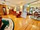 Spacious living room featuring hardwood floors with adjacent dining area at 302 Luna Rd, Auburndale, FL 33823