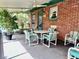 Covered patio with brick walls, outdoor furniture, ceiling fans, and view of the backyard at 302 Luna Rd, Auburndale, FL 33823