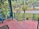 Inviting front porch with two chairs and beautiful landscaping at 302 Luna Rd, Auburndale, FL 33823