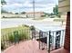 Exterior stairs and landing with decorative railing and view of street and neighboring building at 302 Luna Rd, Auburndale, FL 33823