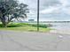 Water view down street with sign at 302 Luna Rd, Auburndale, FL 33823