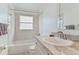 Bathroom features white vanity and a tub/shower combo at 307 Balmoral Ct, Davenport, FL 33896