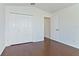 Bedroom featuring wood floors, closet and ensuite bathroom at 307 Balmoral Ct, Davenport, FL 33896