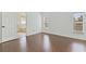 Bright bedroom with hardwood floors, large windows, and an ensuite bathroom at 307 Balmoral Ct, Davenport, FL 33896