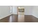 Living room features wood floors and a sliding glass door to the outdoor patio at 307 Balmoral Ct, Davenport, FL 33896
