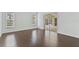 Bright living room with hardwood floors and sliding door access to the lanai at 307 Balmoral Ct, Davenport, FL 33896