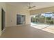 Covered patio area with ceiling fan and view of the screened pool at 307 Balmoral Ct, Davenport, FL 33896