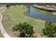 Expansive golf course view with lush greens, waterfront scenery and luxury homes, ideal for recreation and relaxation at 3071 Shoal Creek Village Dr, Lakeland, FL 33803