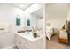 Bright bathroom with a large mirror and doorway to a bedroom suite at 3071 Shoal Creek Village Dr, Lakeland, FL 33803