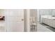Bathroom view leading to the shower, providing an efficient, private space at 3071 Shoal Creek Village Dr, Lakeland, FL 33803