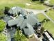 Aerial view of clubhouse with golf course, set amongst palms at 3071 Shoal Creek Village Dr, Lakeland, FL 33803