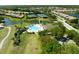 Community pool with inviting pool and golf course, with luxurious waterfront homes at 3071 Shoal Creek Village Dr, Lakeland, FL 33803