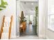 Bright entryway with tile flooring, a wooden accent ladder, and views into a well-lit living space beyond at 3071 Shoal Creek Village Dr, Lakeland, FL 33803