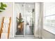 Bright entryway featuring tile floors, a wooden accent ladder, and view into a well-lit living space beyond at 3071 Shoal Creek Village Dr, Lakeland, FL 33803