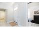 Bright entryway featuring neutral tile flooring, white walls, and direct access to bedroom/office at 3071 Shoal Creek Village Dr, Lakeland, FL 33803